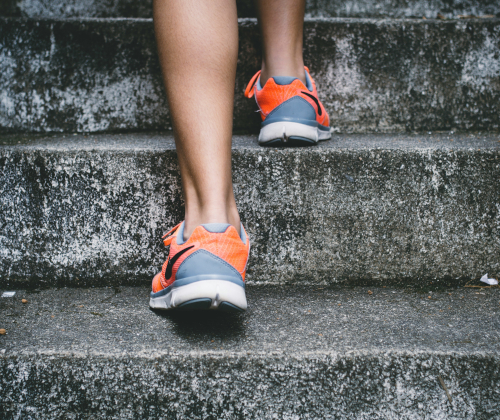 Person in shoes running up steps Person in shoes running up steps